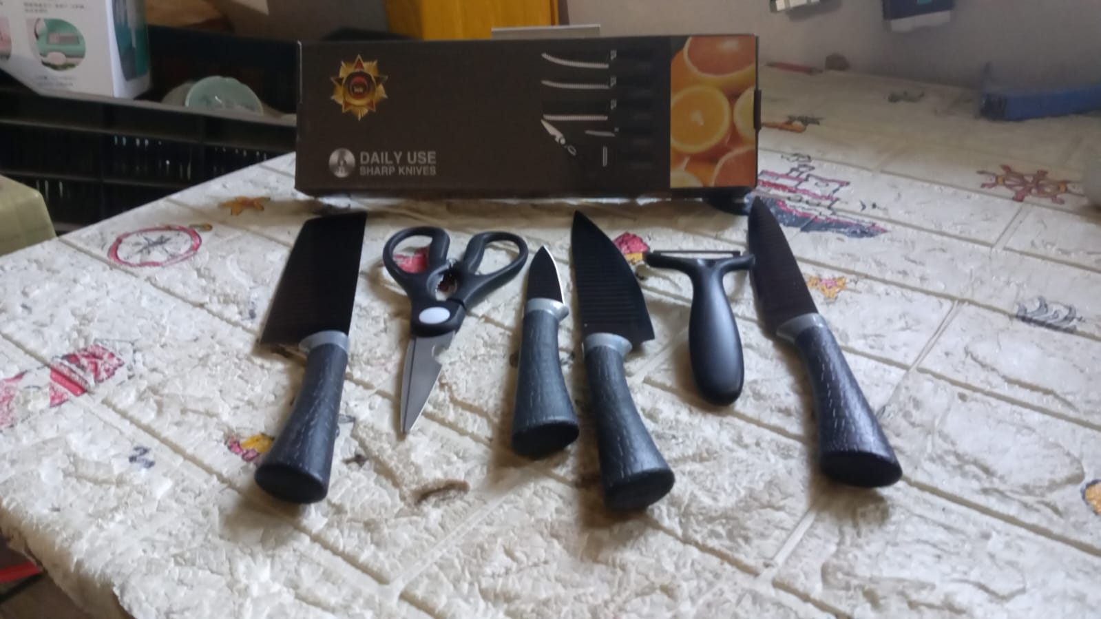 Complete 6-piece kitchen knife set displayed on wooden surface