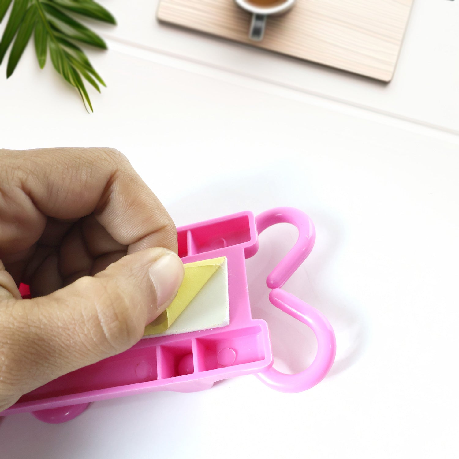 Pink multi-purpose hanging organizer folded