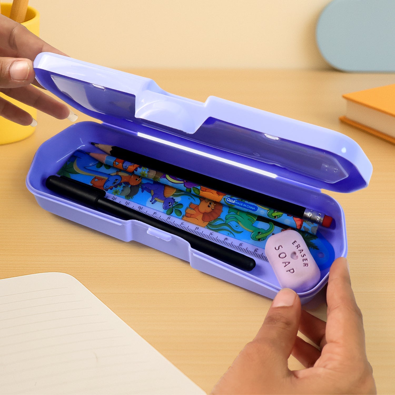 Angled view of the plastic Kids Pencil Box, showcasing its secure snap-lock closure.