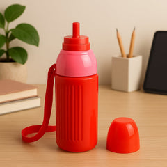 Insulated sports water bottle placed upright with carry strap