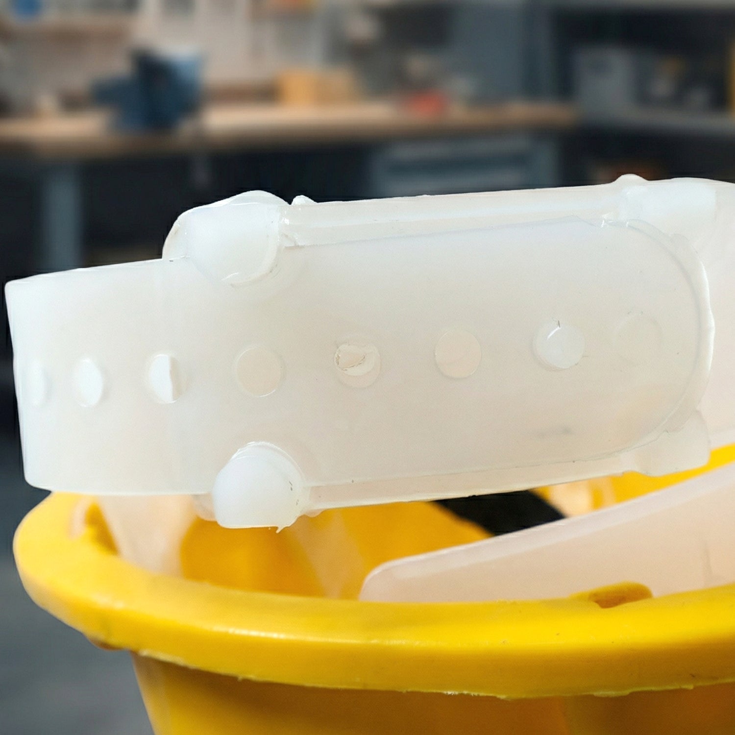 Yellow protective hard hat with lightweight and functional design for factory use