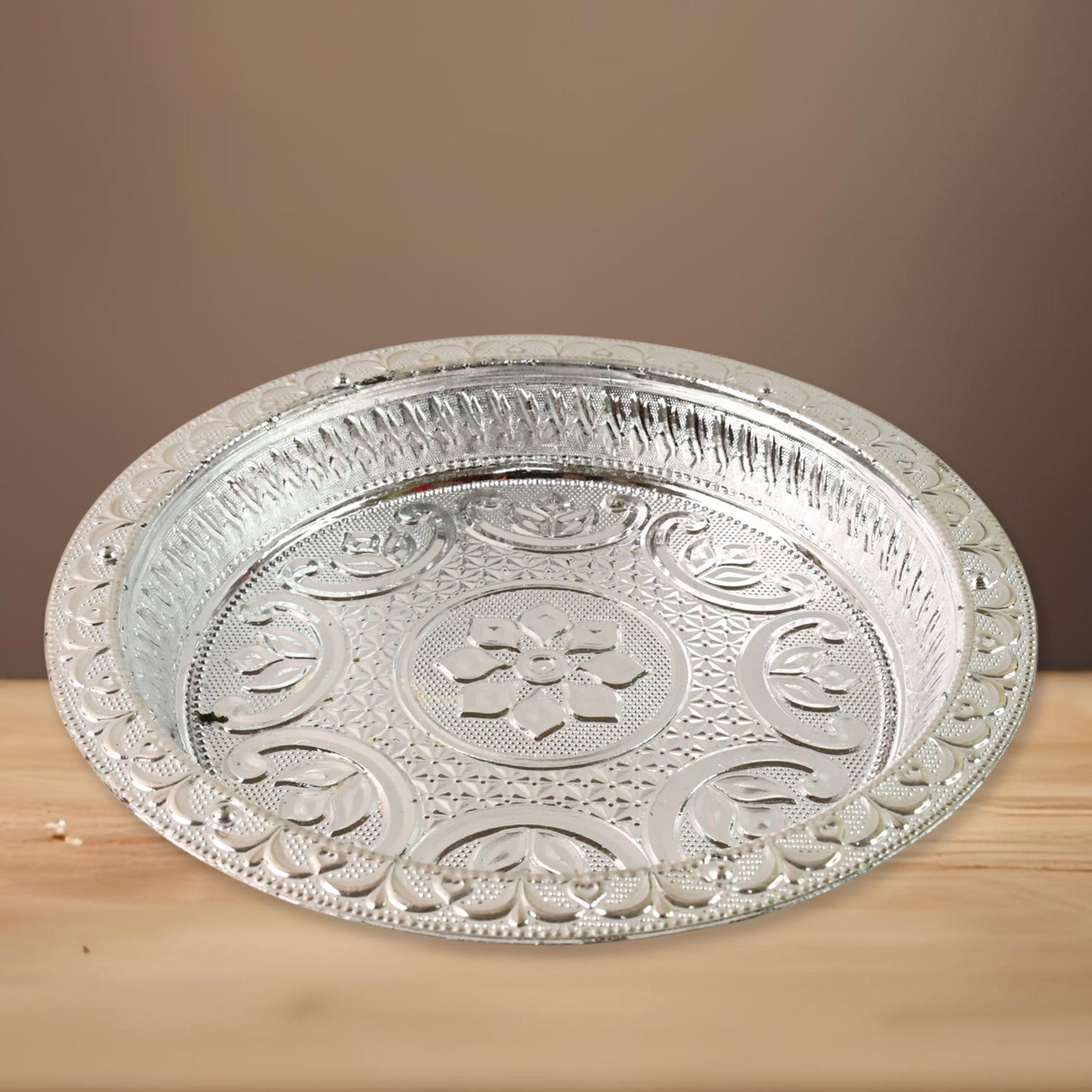 Lightweight plastic pooja thali with silver tone finish