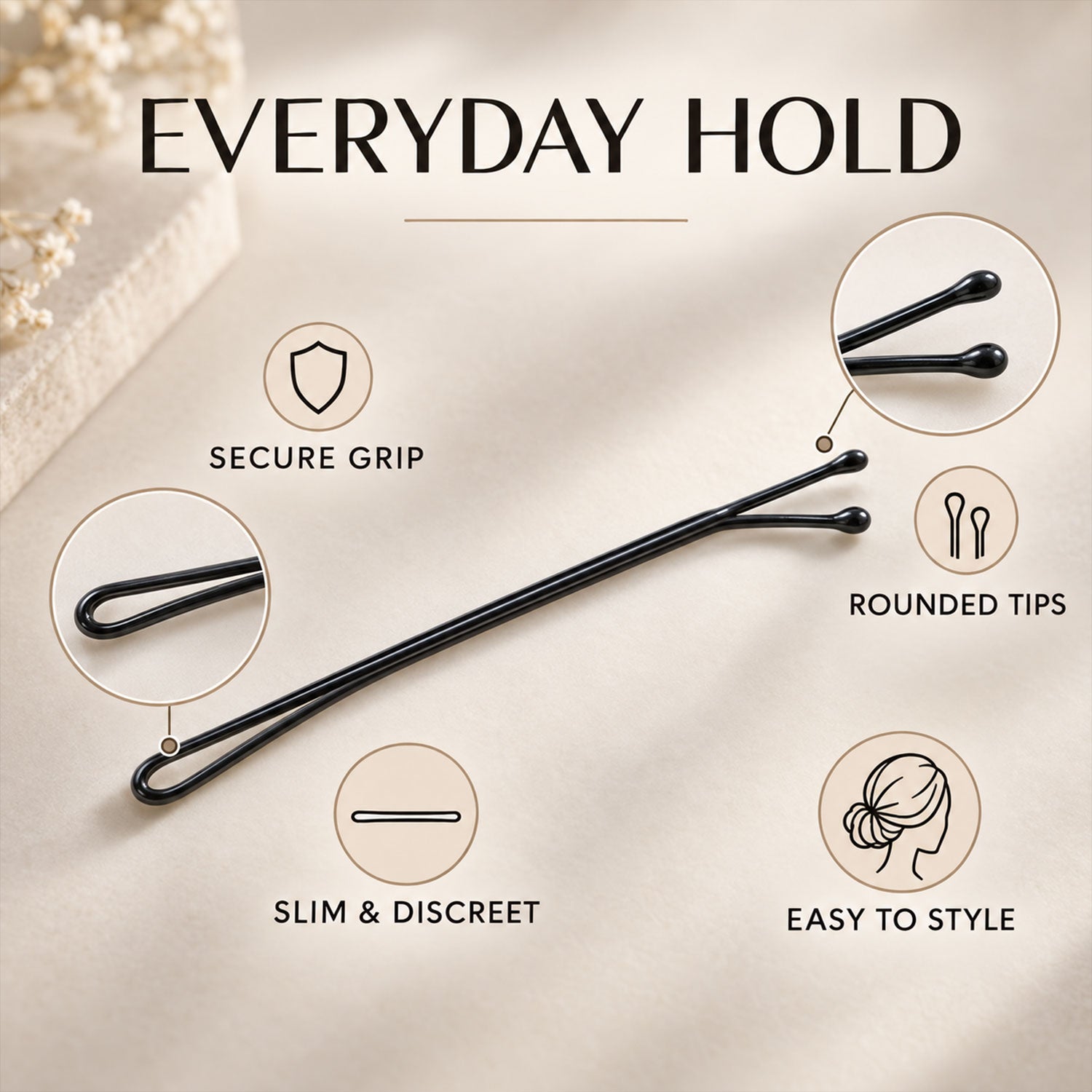 A black U-shaped hair pin is surrounded by circular insets highlighting its secure grip and rounded tips.