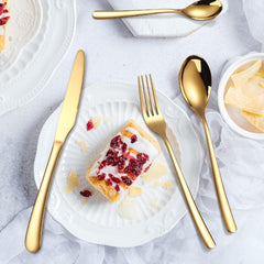 Gold flatware set with forks and spoons displayed