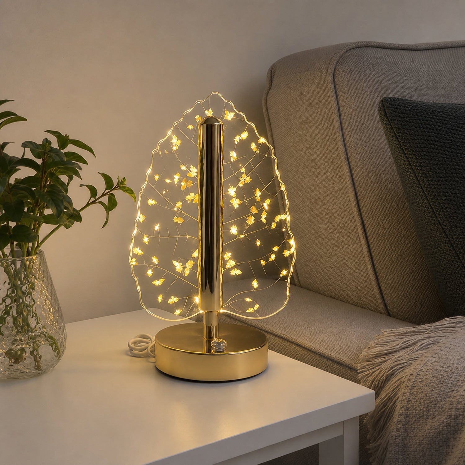 Living room showcasing golden crystal leaf LED lamp