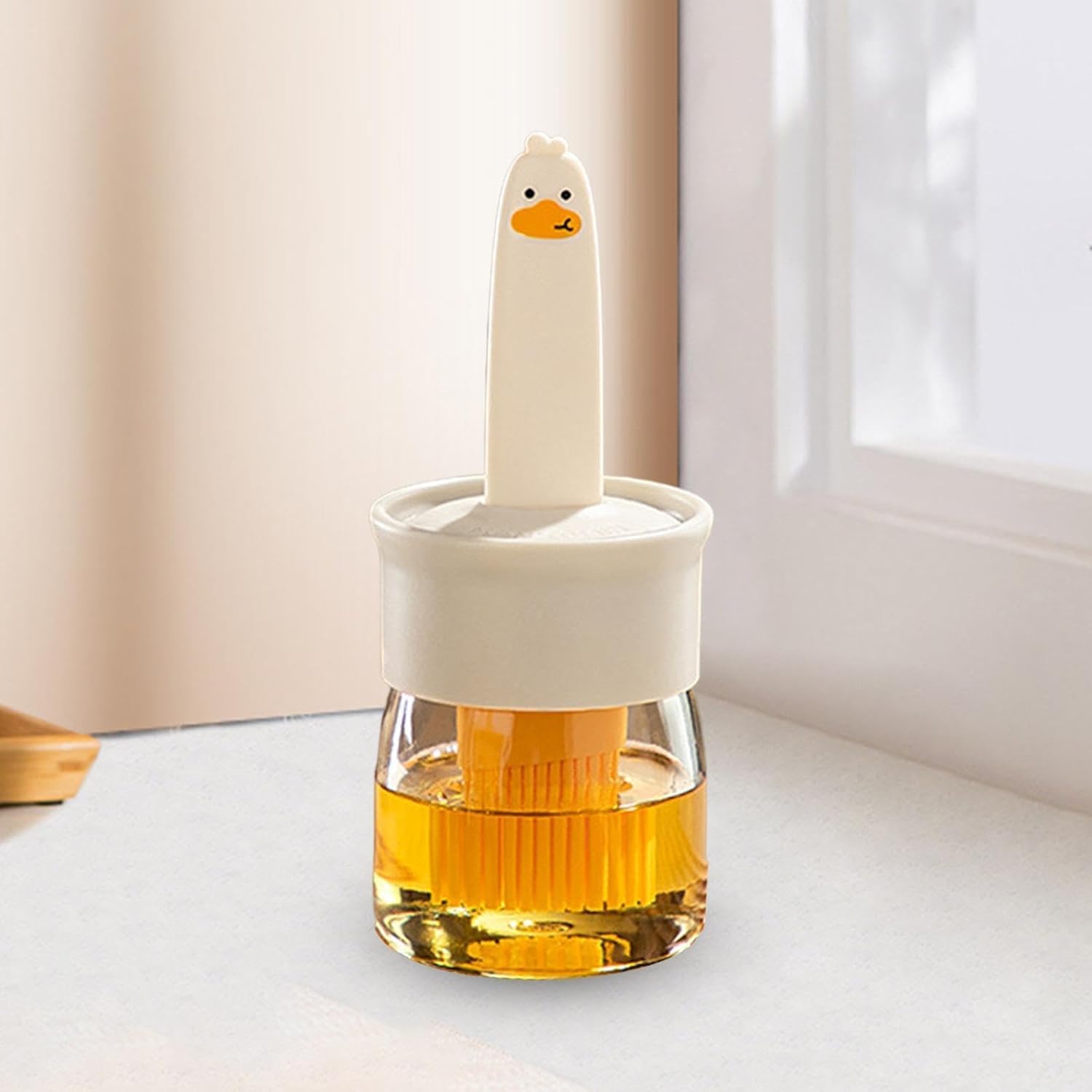 Oil dispenser bottle combined with basting brush suitable for various cooking tasks
