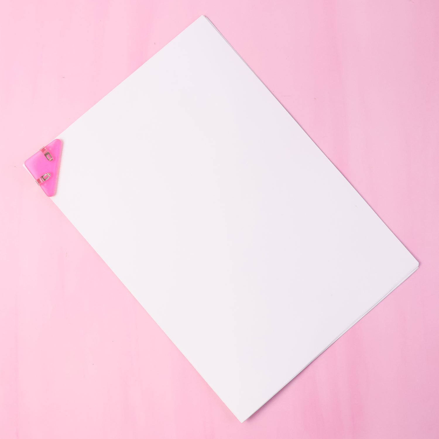 Triangle paper clip holding documents