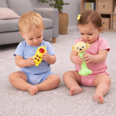 Assortment of vibrant baby rattles on a white background