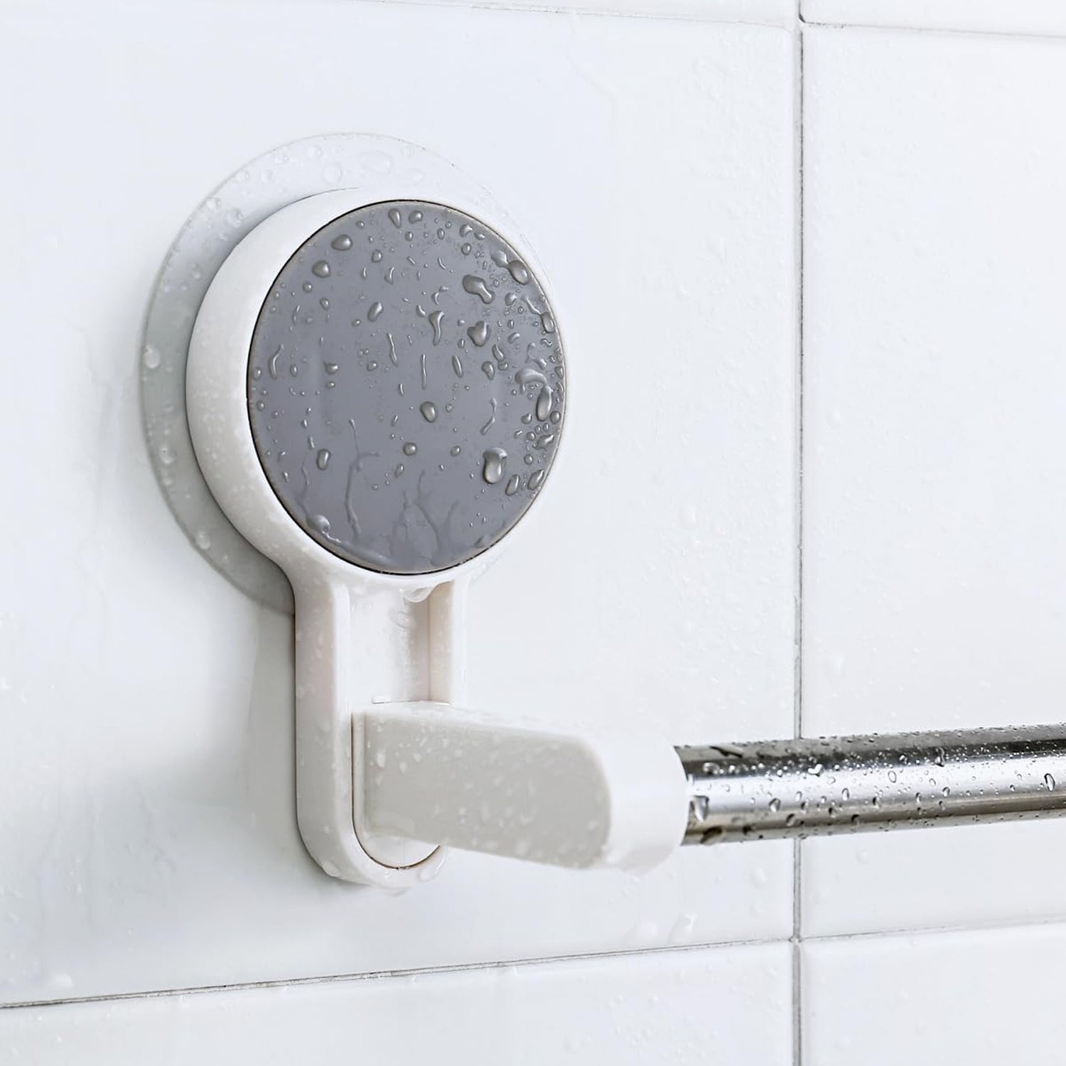 Removable and reusable adhesive towel rod mounted on tile wall