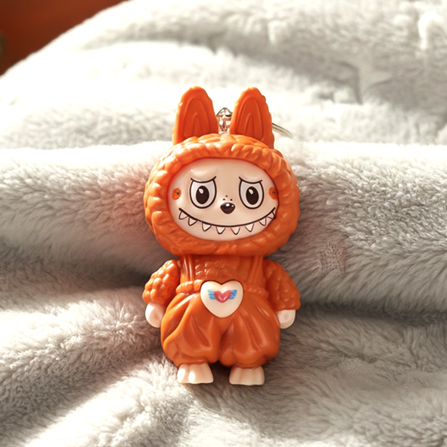 Cartoon character keychain toy highlighting smooth rounded finish