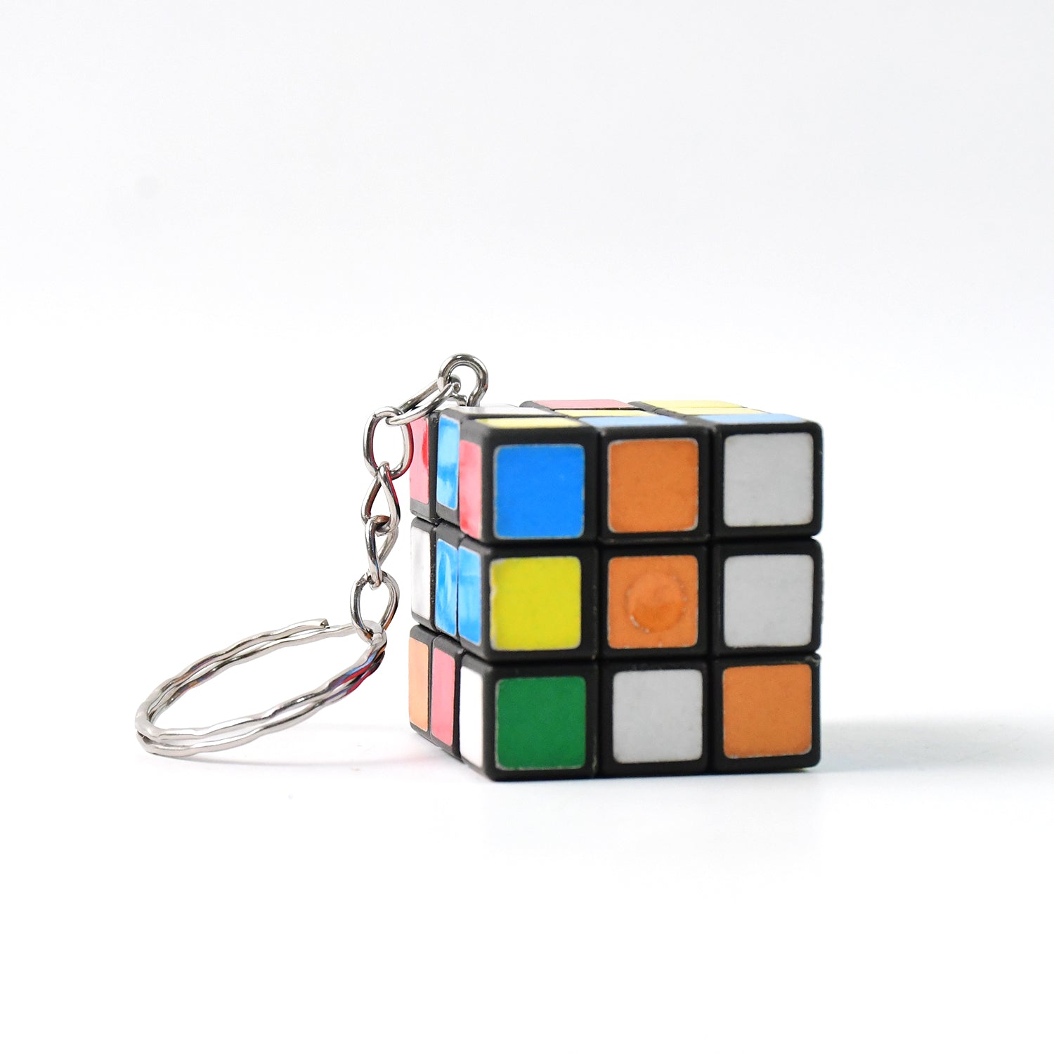 Mini cube puzzle close up on white background