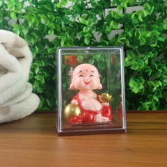 Side view of nodding solar Buddha car ornament