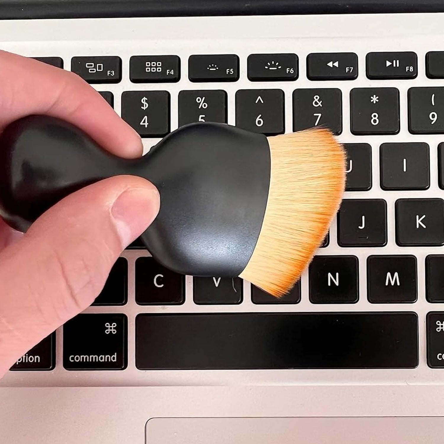 Mini soft car cleaning brush on a white background