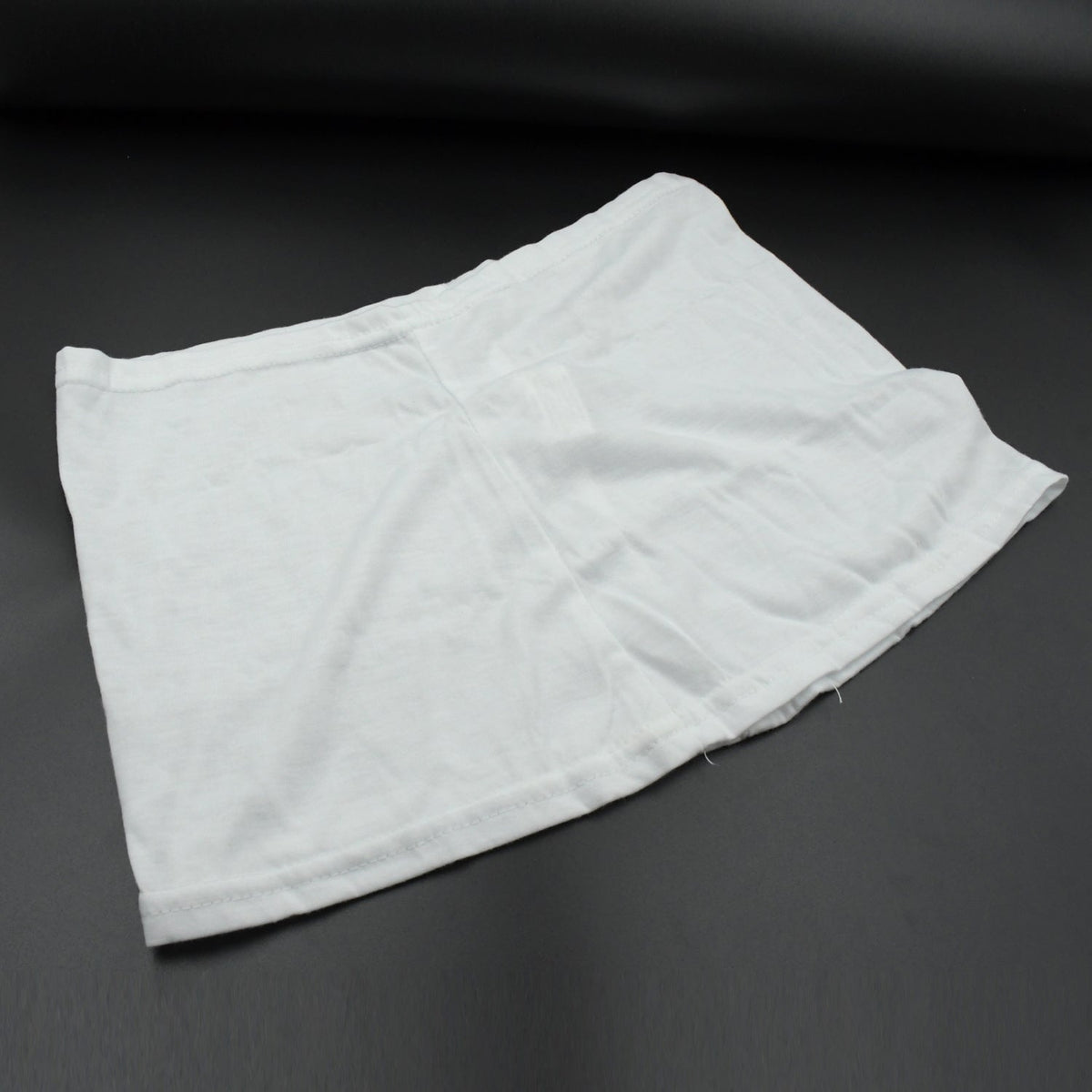 Women's high-waisted athletic skort front view in white