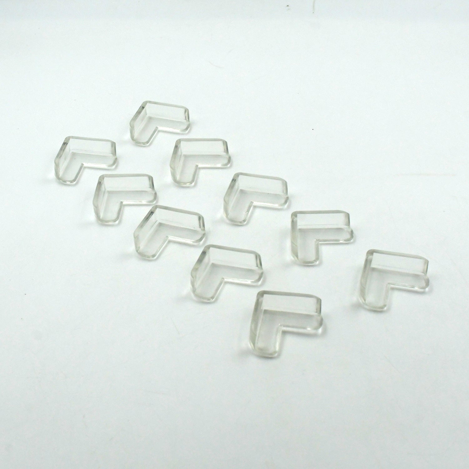 Clear corner guards applied to sharp furniture edges