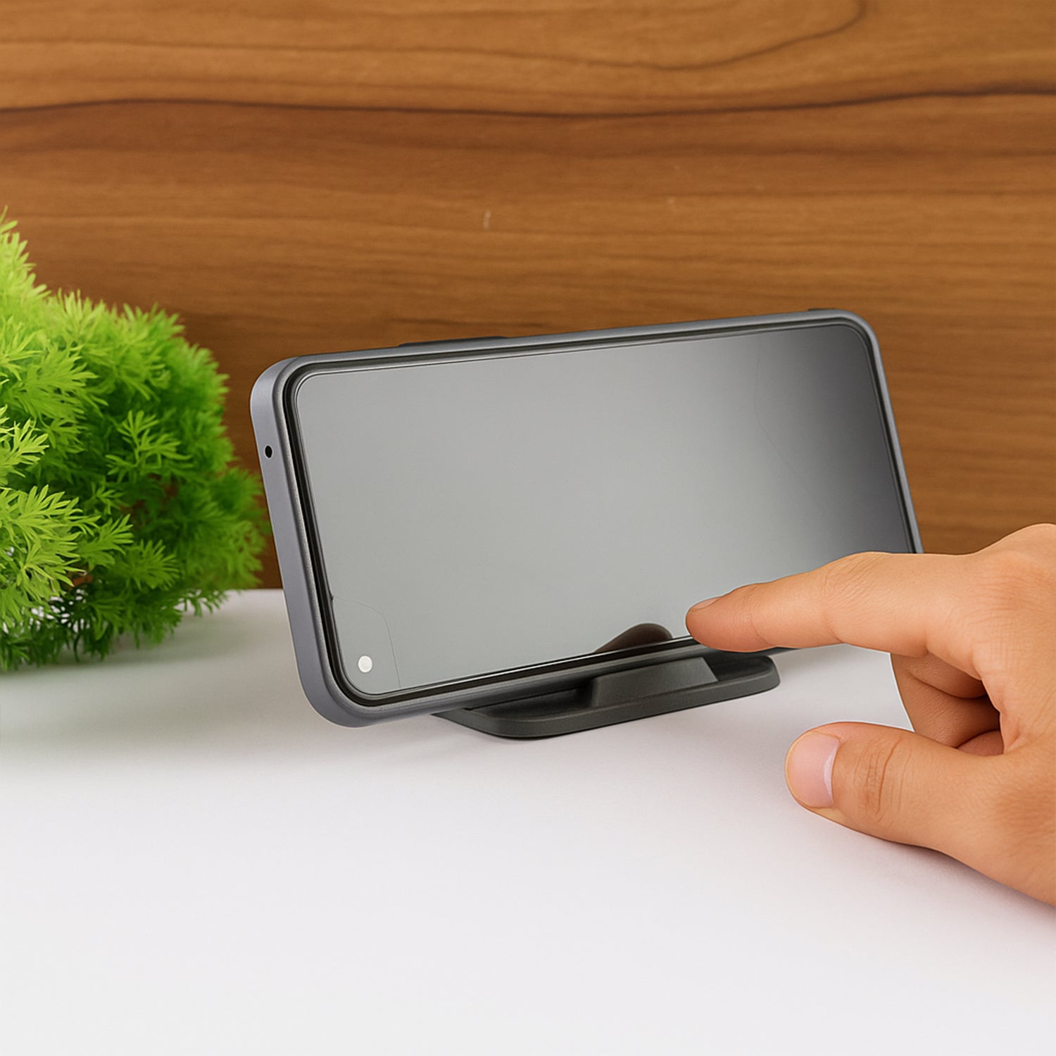 Ergonomic Black Pyramid Phone Stand holding a smartphone
