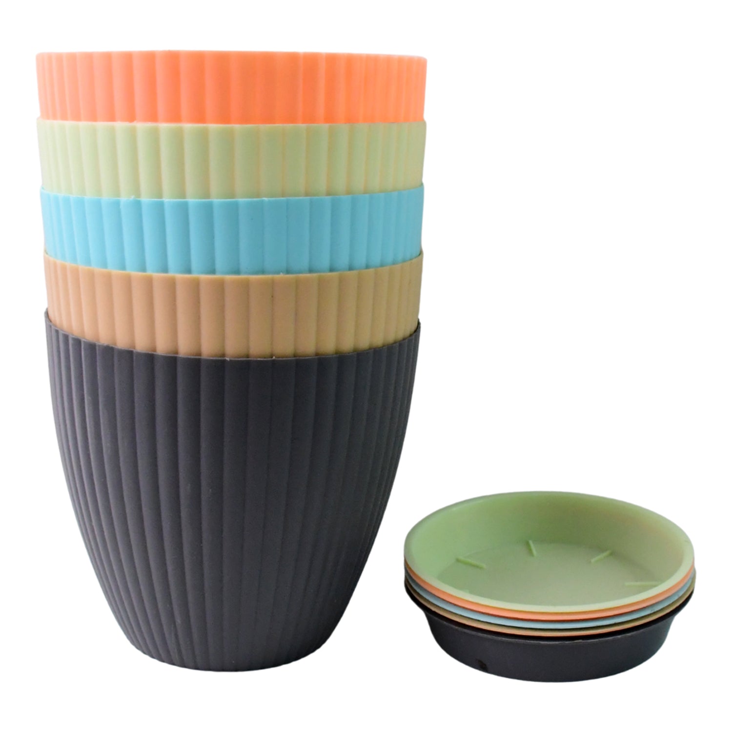 Round plastic flower pot with plant inside on windowsill