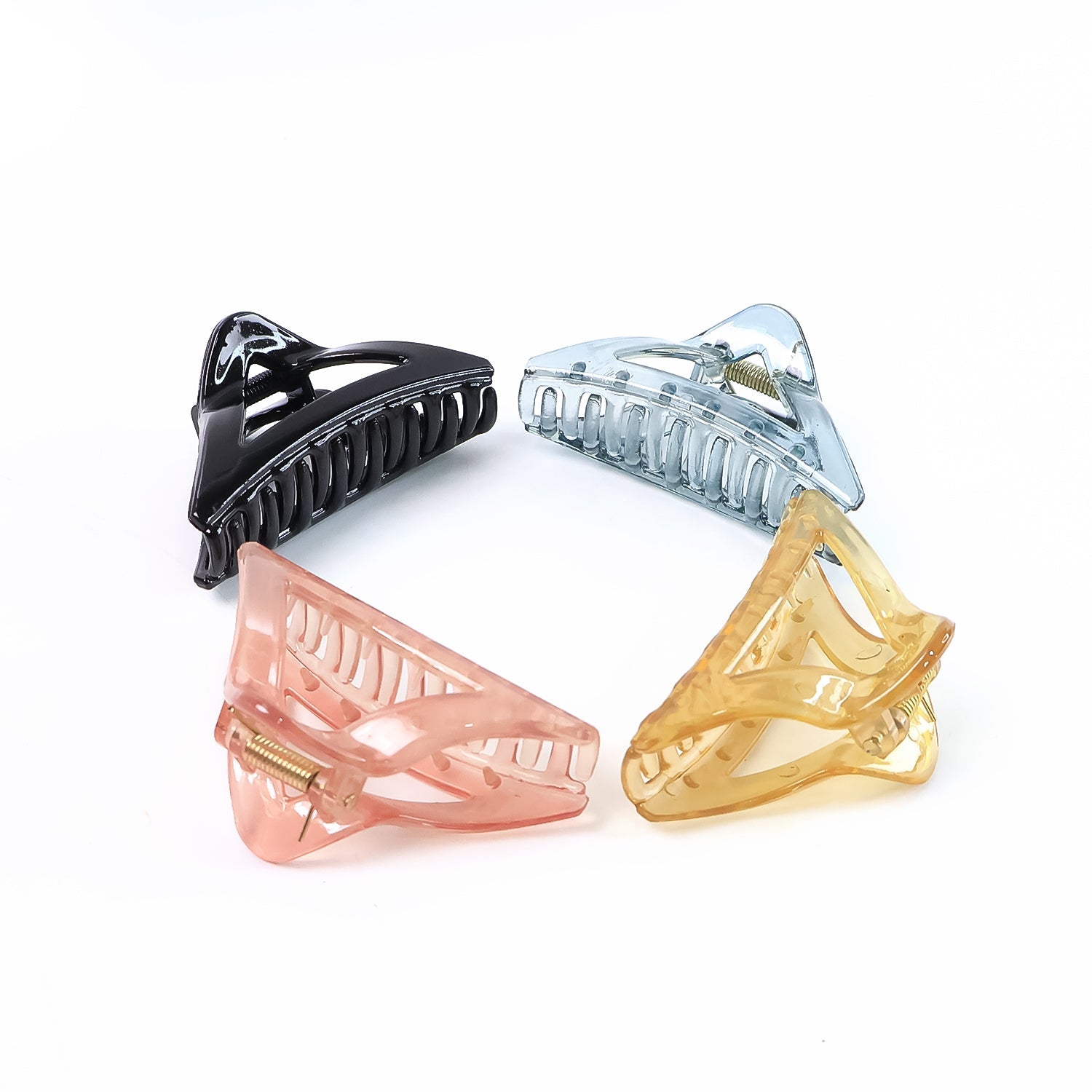 Assorted color triangle plastic hair claw clips laid out