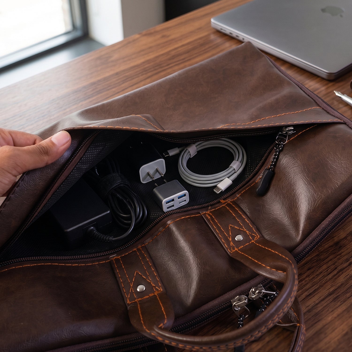 Roomy leather laptop bag with padded compartment and inner pockets