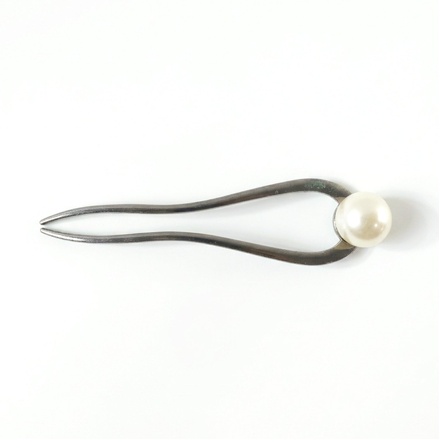 Close-up of pearl hair pin