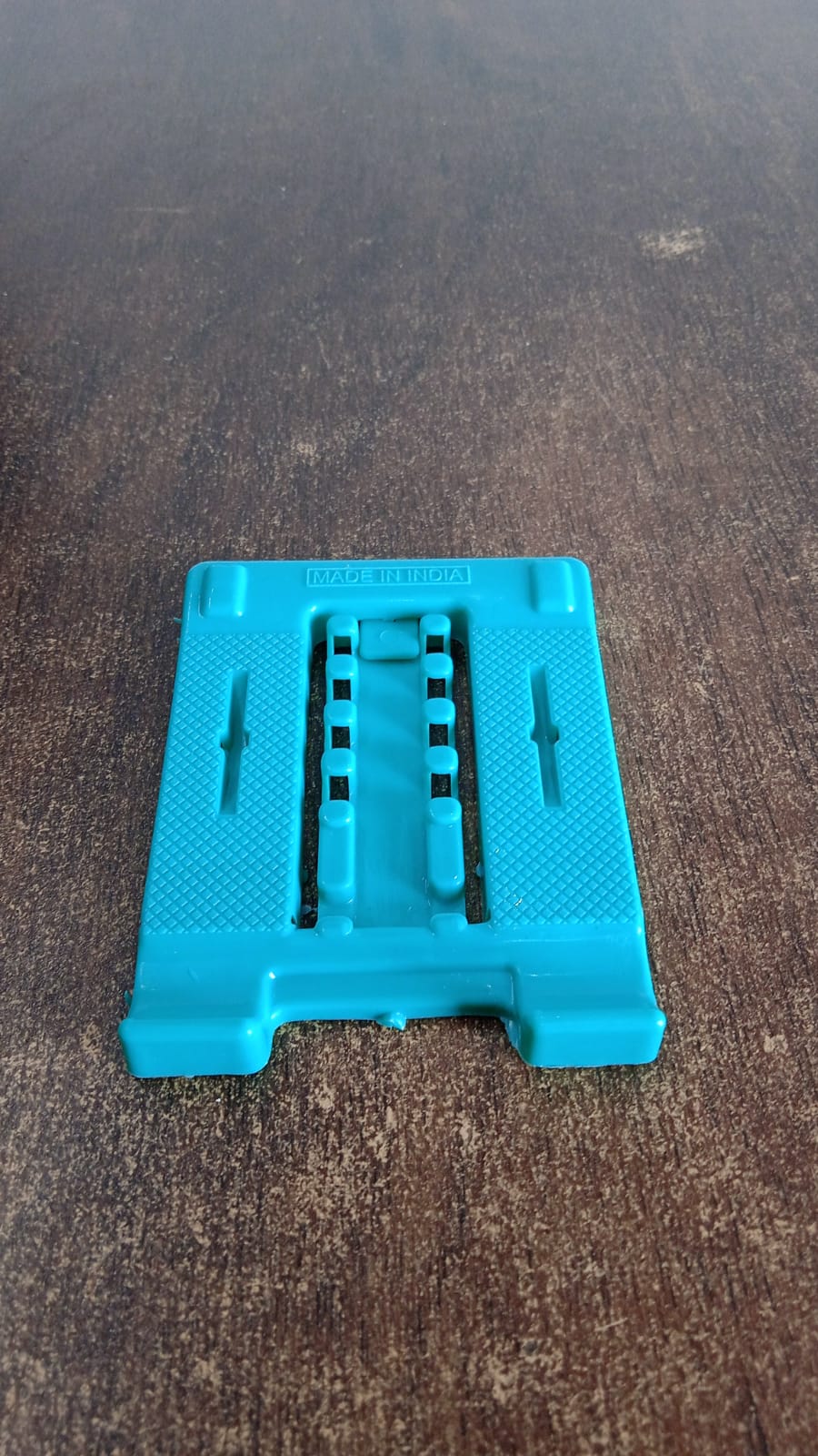 Foldable mobile stand holding a smartphone