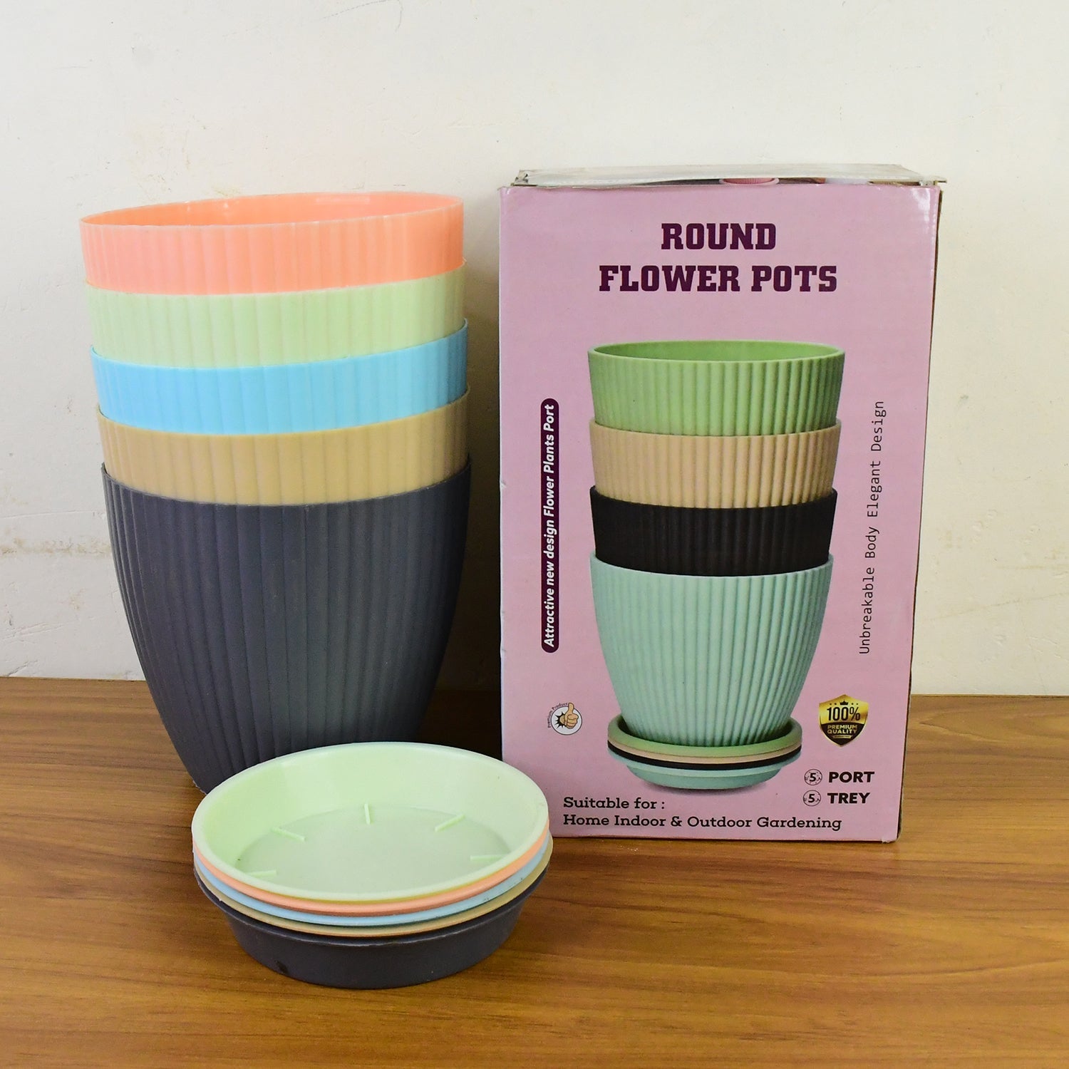 Round plastic flower pots displayed in indoor garden setting
