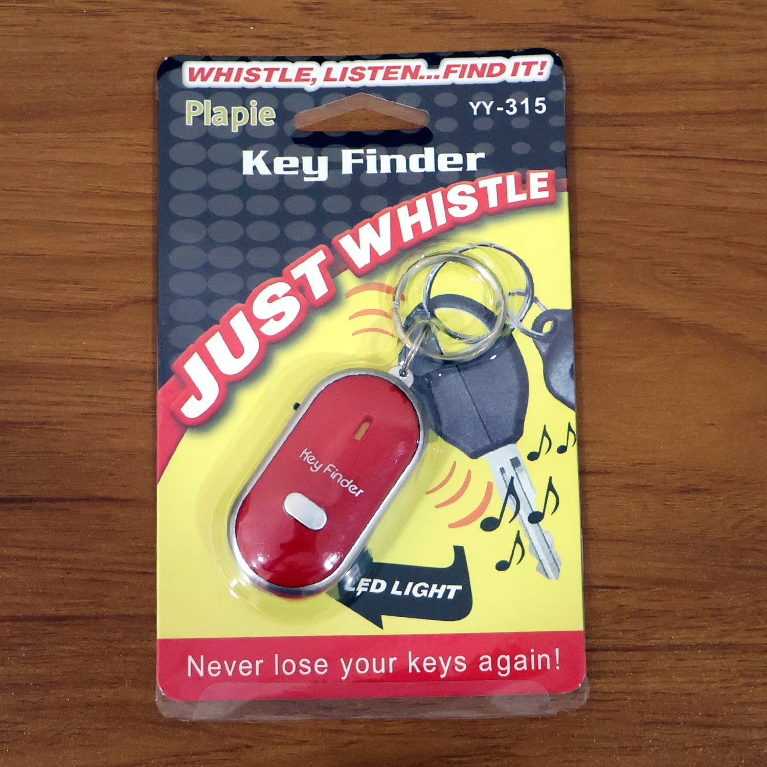 JourneyMate key finder keychain in hand