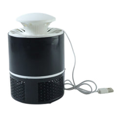 Mosquito trap device unplugged on table