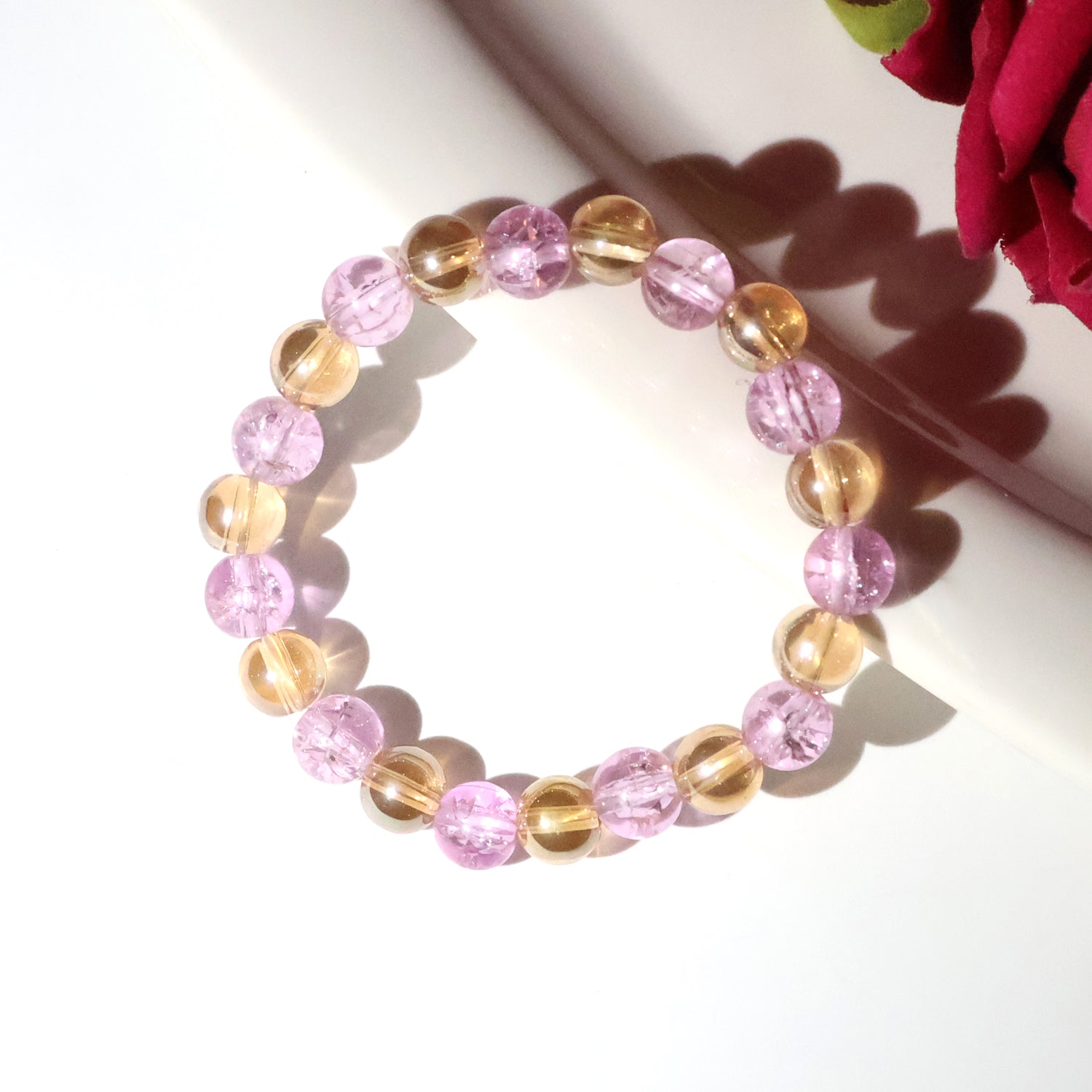 Close-up of crystal beads on dual-tone stretch bracelet