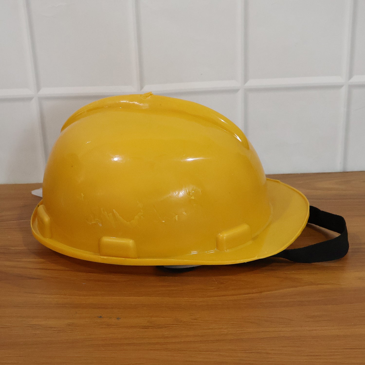 Yellow safety helmet offering reliable protection from head injuries on construction sites