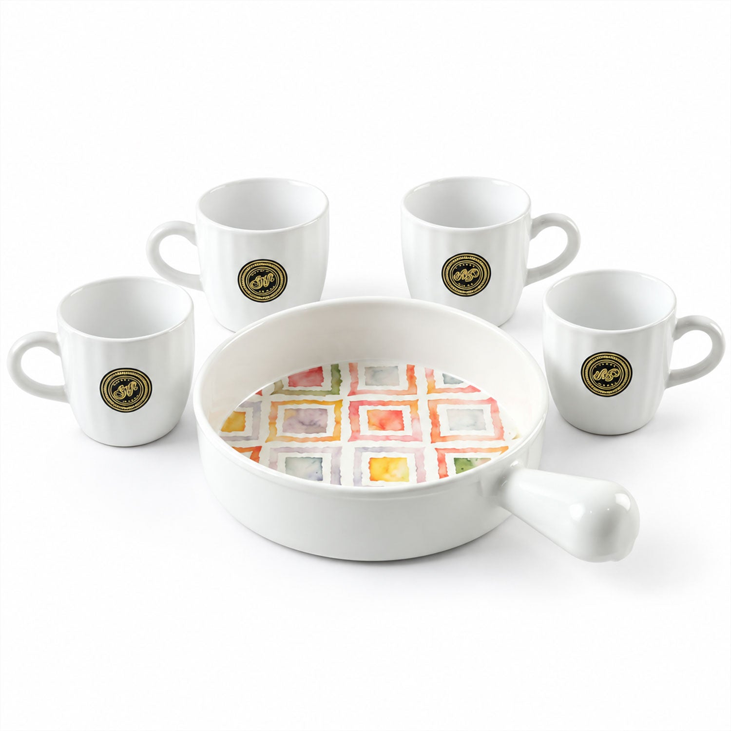A white ceramic platter with a colorful square pattern is centered, surrounded by four matching white mugs on a plain
