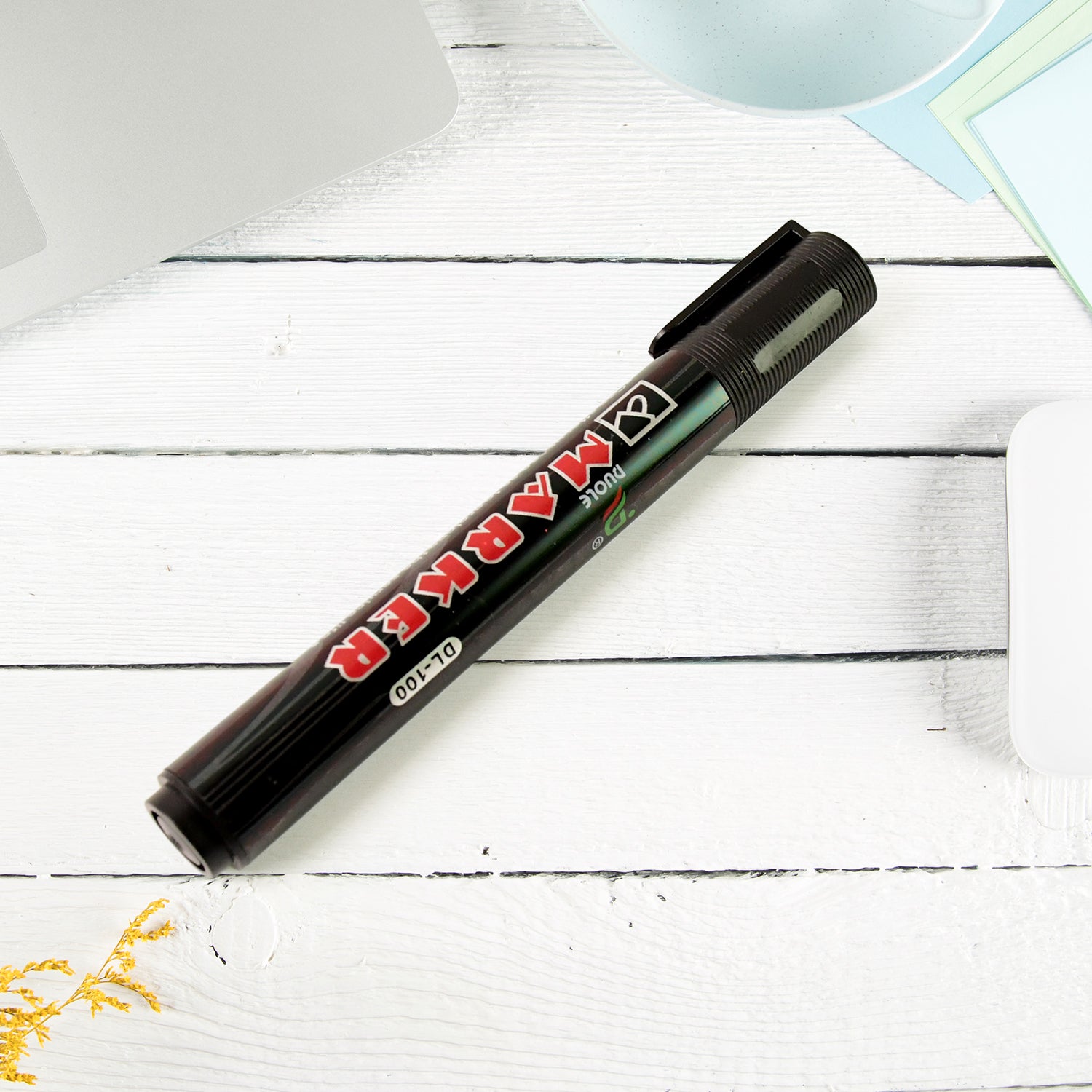 Black ink whiteboard marker writing on whiteboard