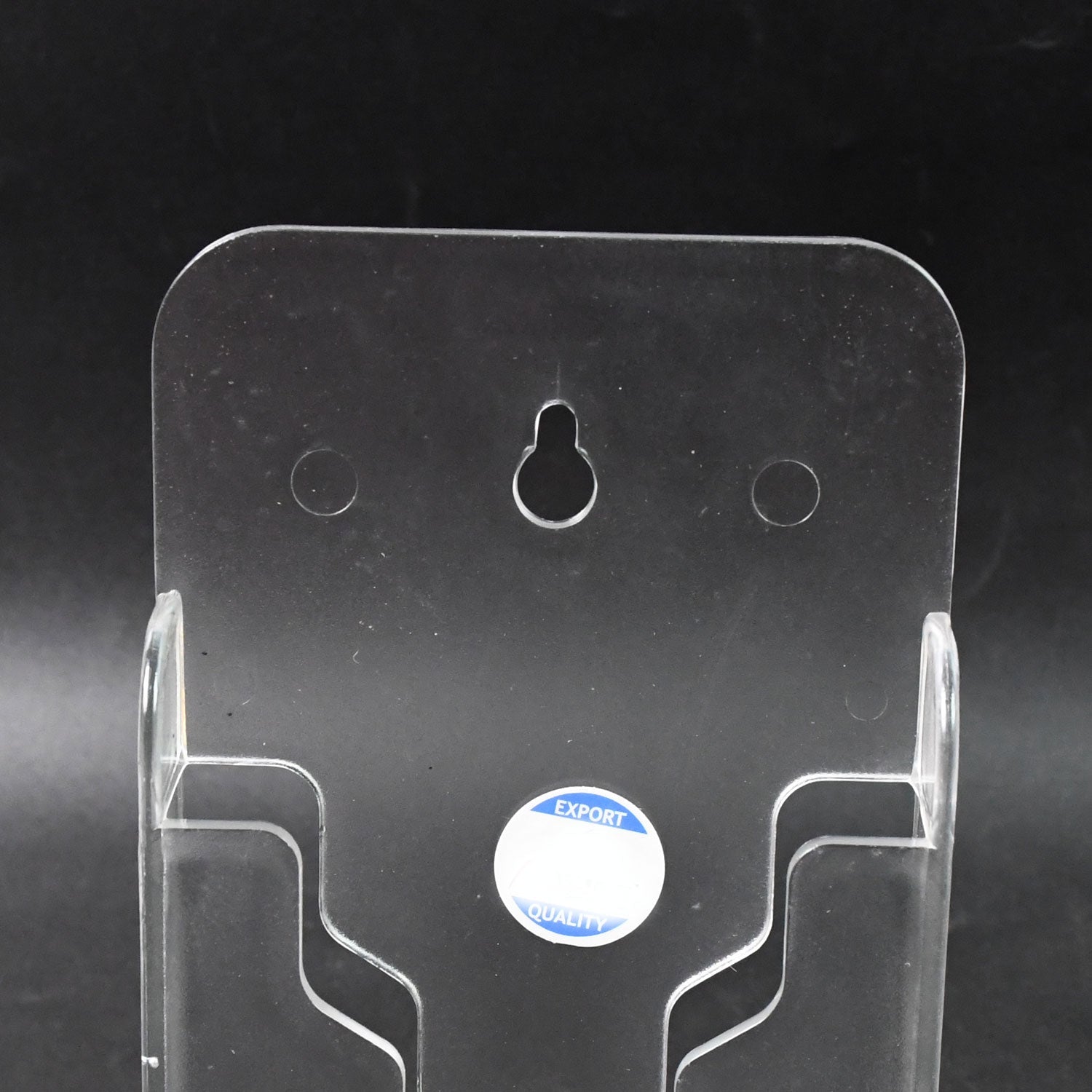 Mobile phone secured in wall mount holder