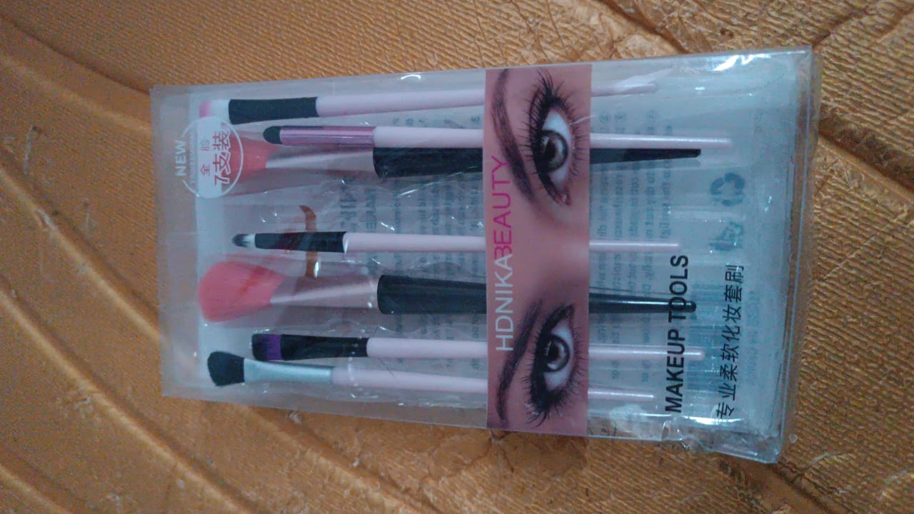 Travel-friendly compact makeup brush set in pouch