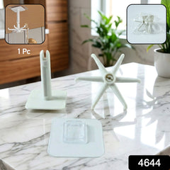 Multiple 360Â° rotating wall hooks holding kitchen utensils