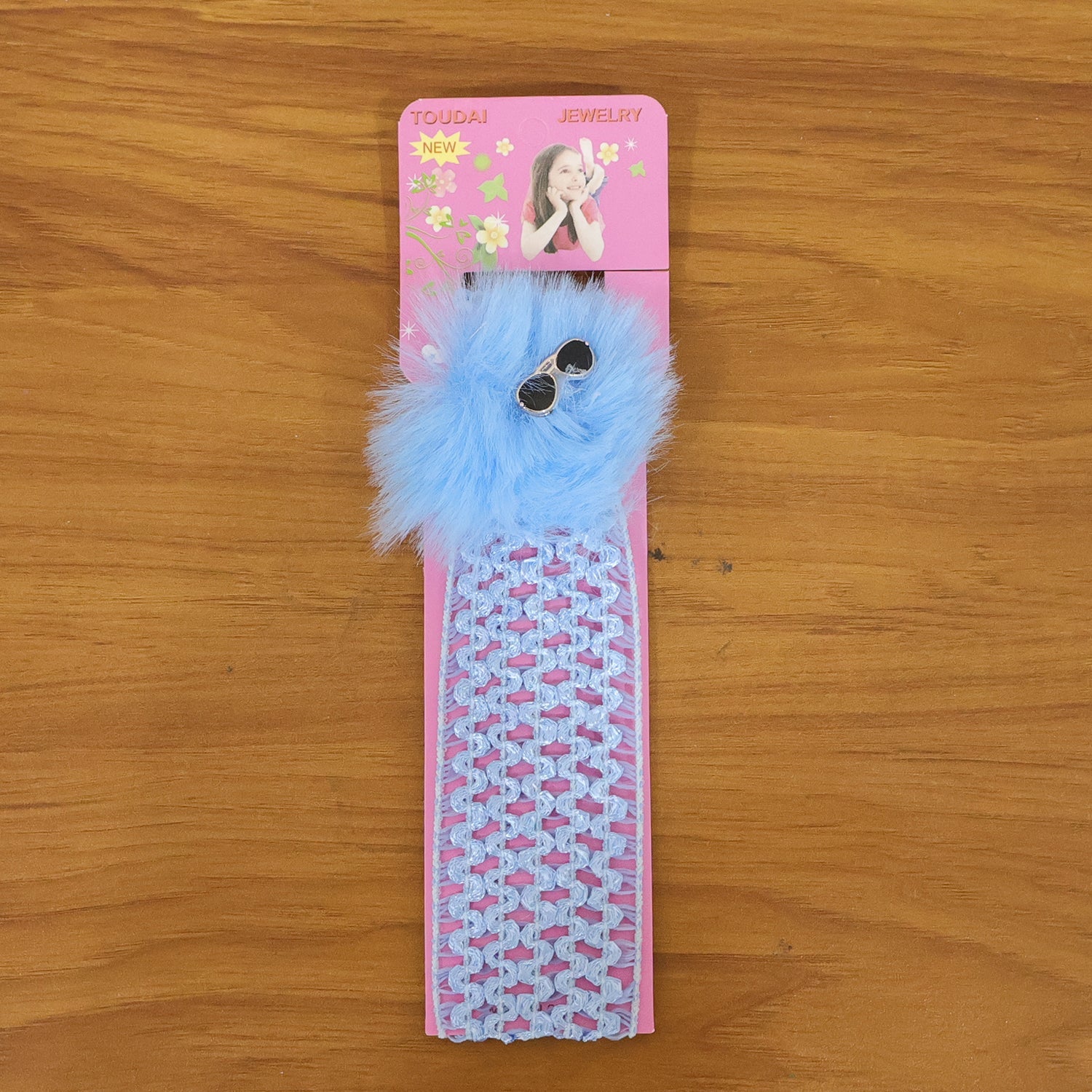 Stylish baby girl headband with pom pom design