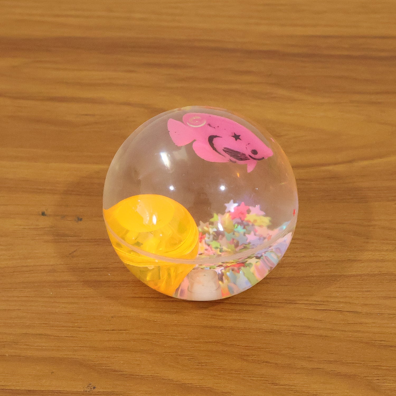 Light-up transparent sensory bouncy ball in use