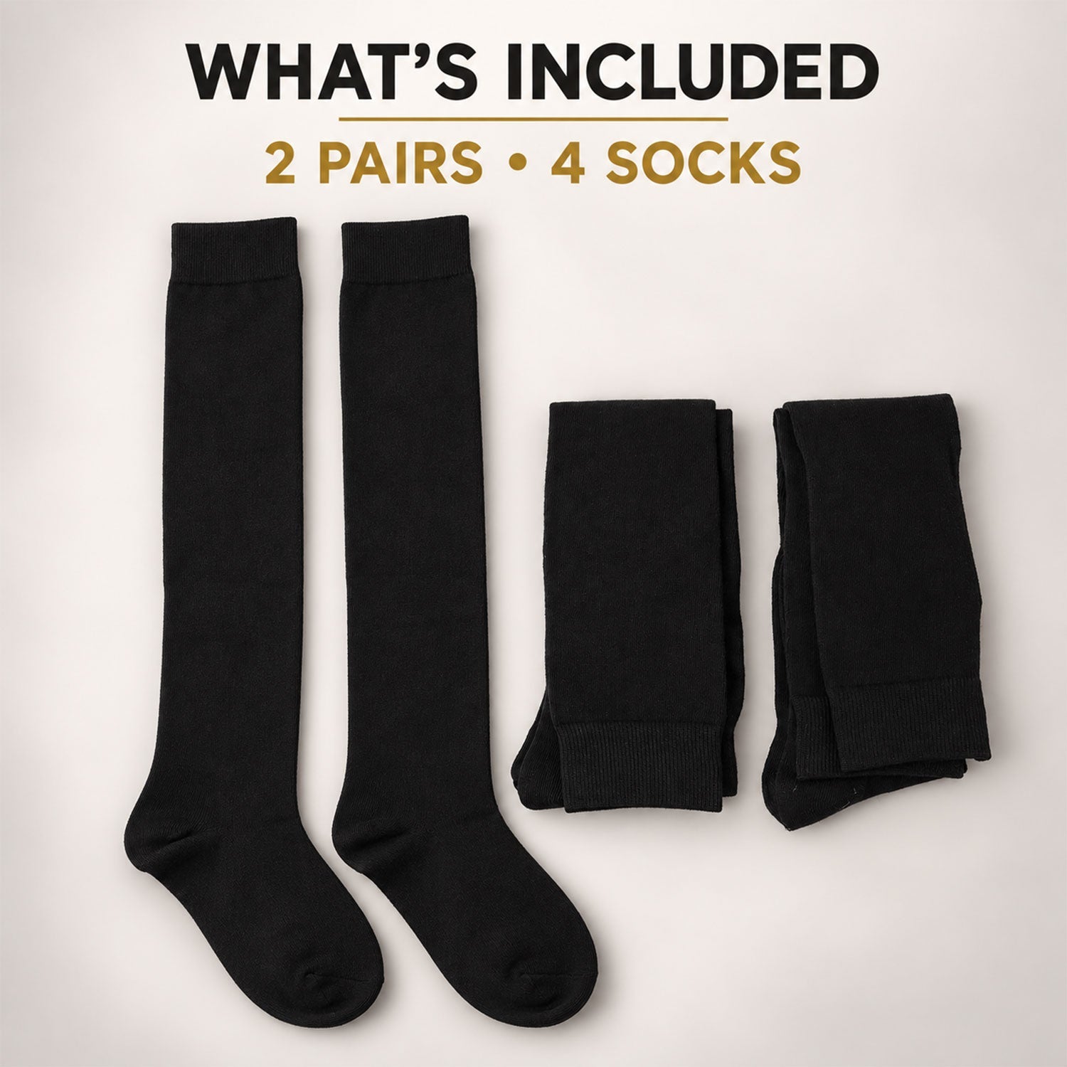 Two pairs of black over-knee socks, one pair laid flat and the other folded, on a light brown background.