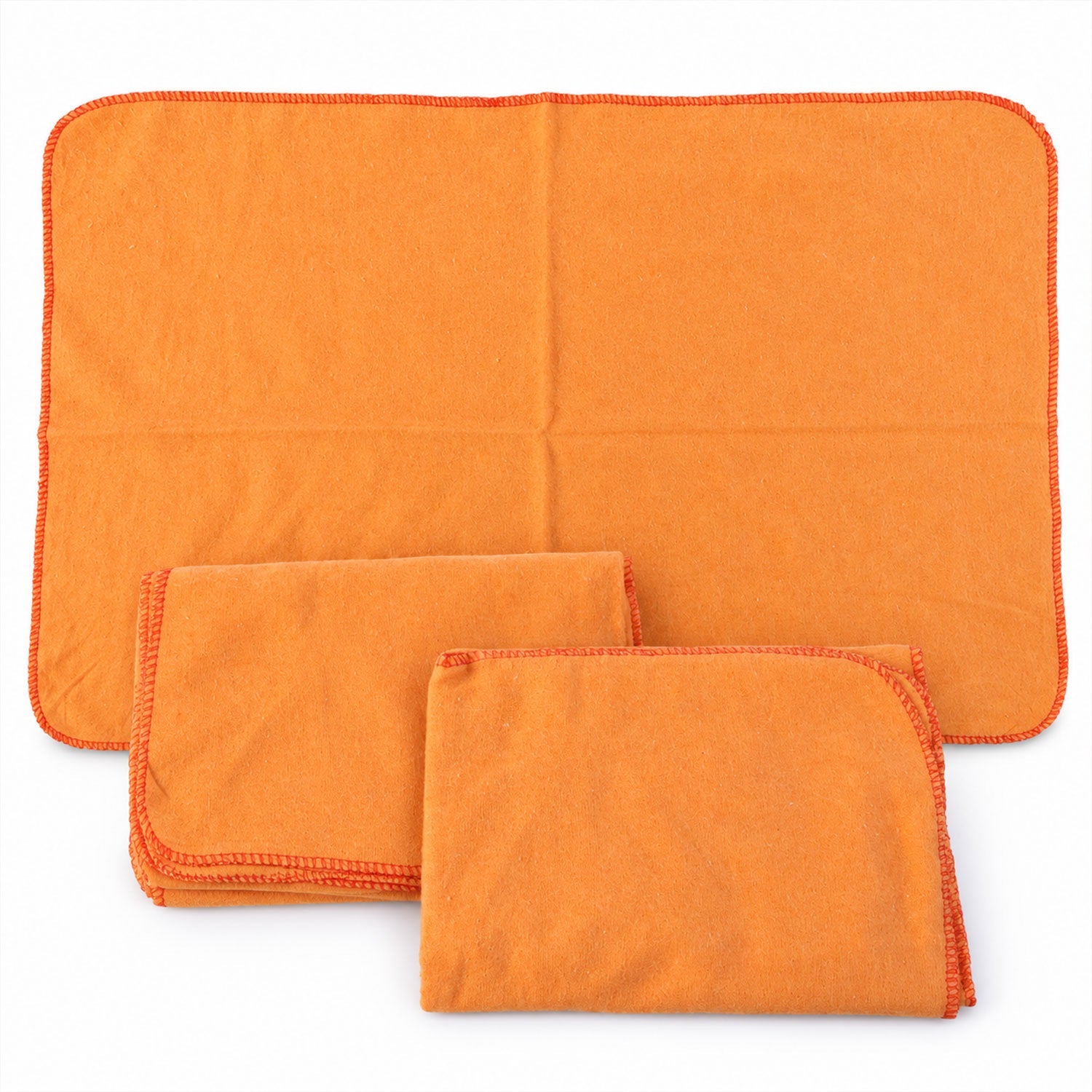 One orange cleaning cloth is unfolded, while two others are neatly folded beside it on a white surface.