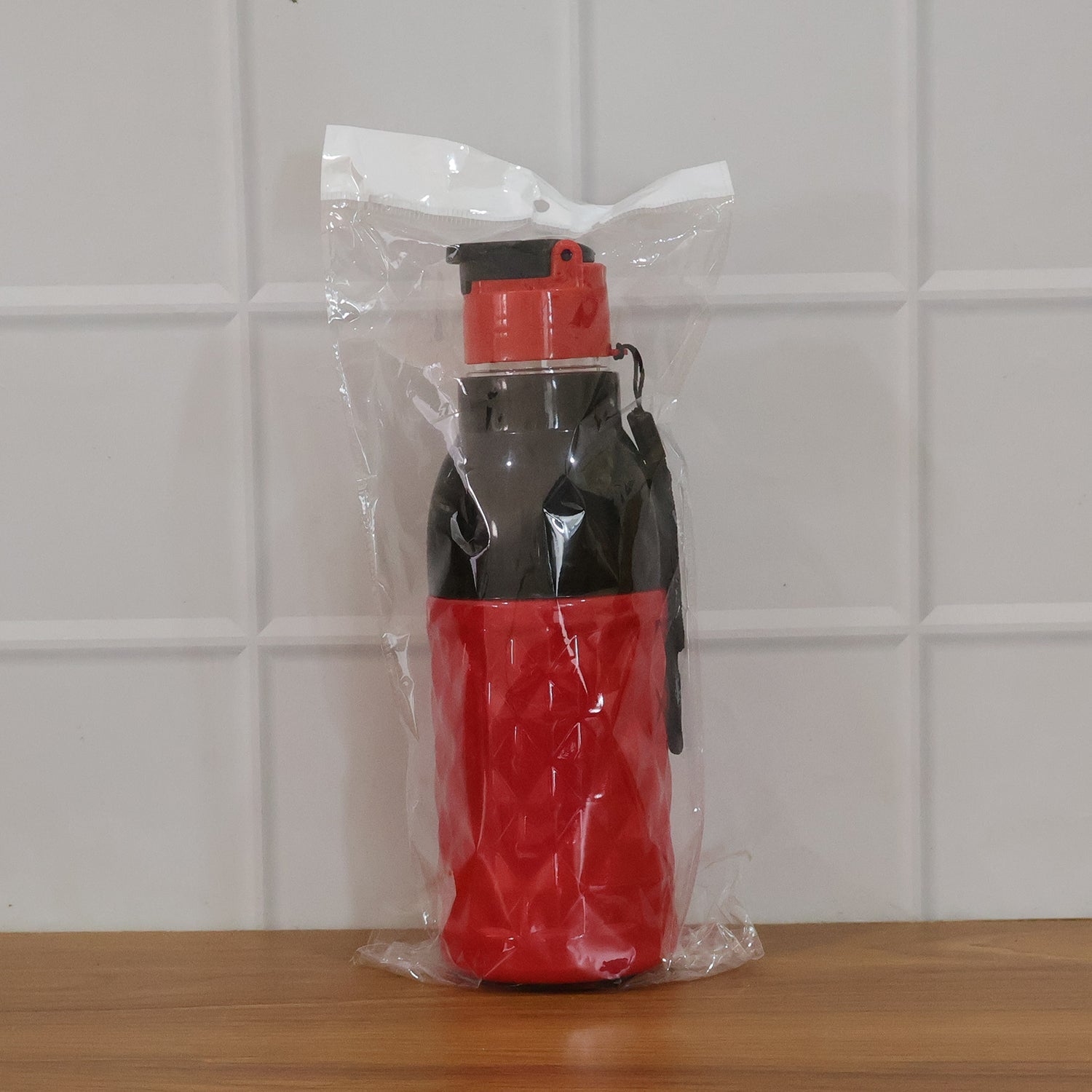 Portable plastic water bottle with strap