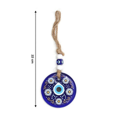 Evil eye wall hanging displayed on a white wall, showing its full length