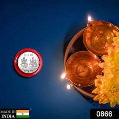 Goddess Lakshmi Pooja Coin displayed on decorative surface