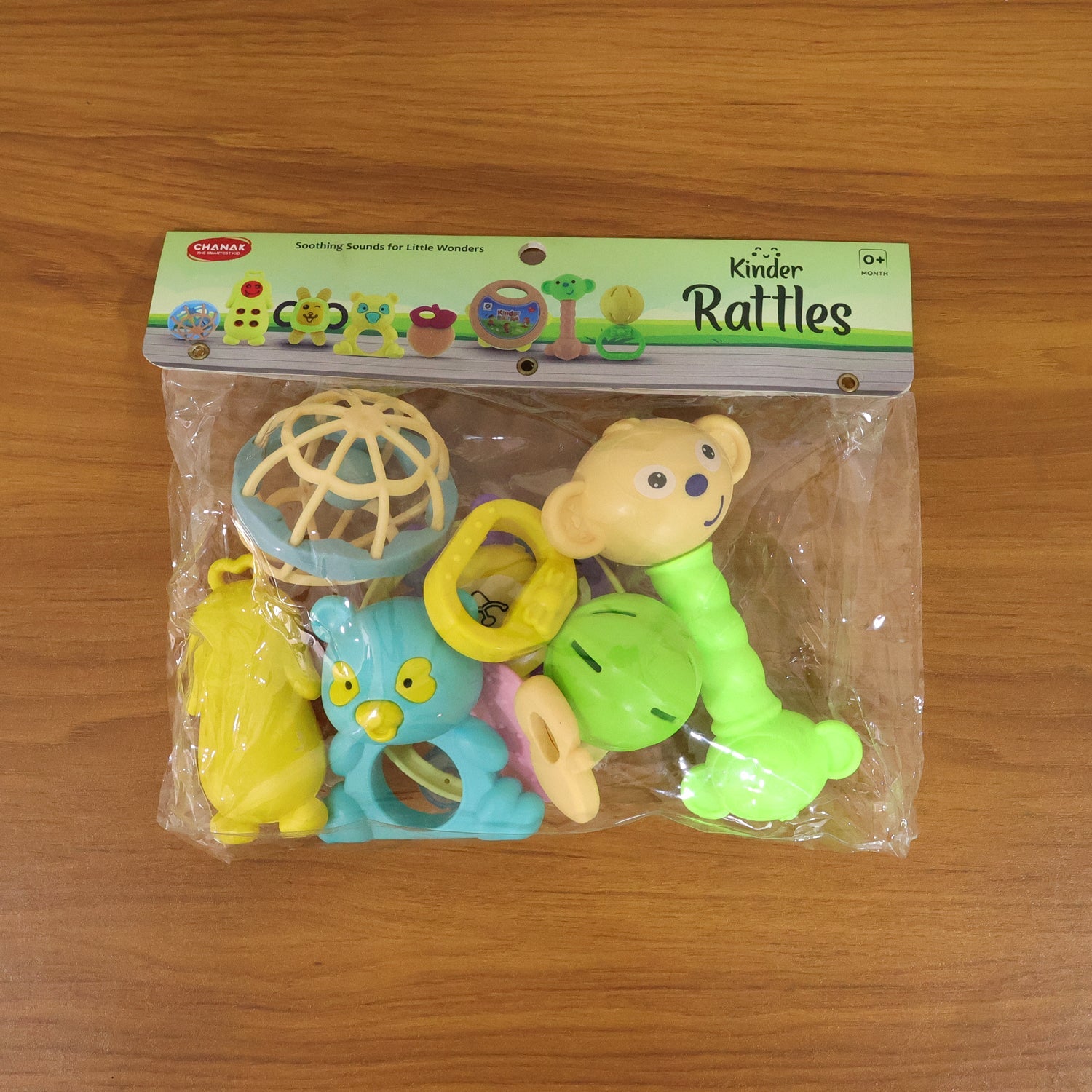 Overhead view of several baby rattles arranged neatly