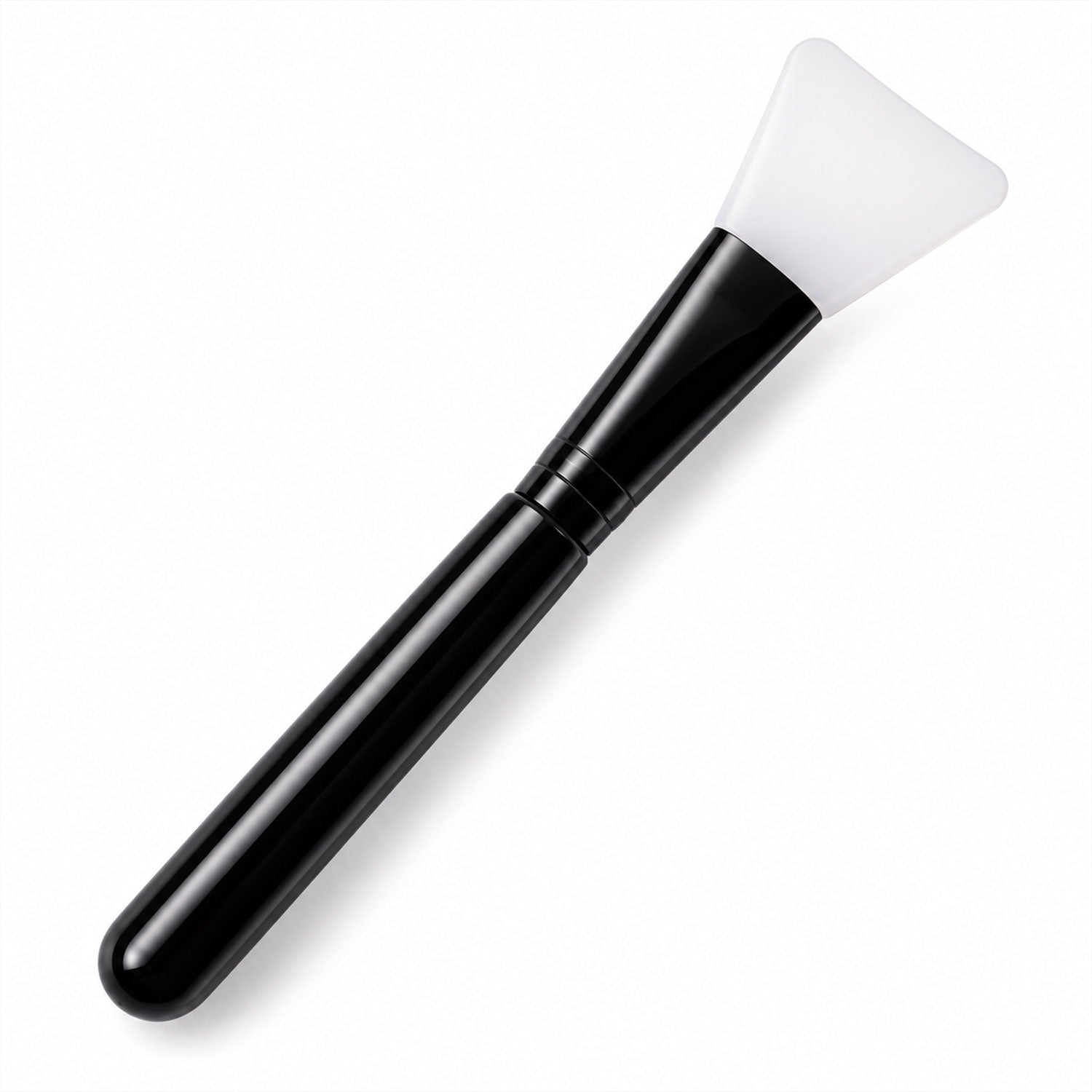 A black and white silicone face mask brush with a wide, flexible head and long handle is angled on a clean white background.