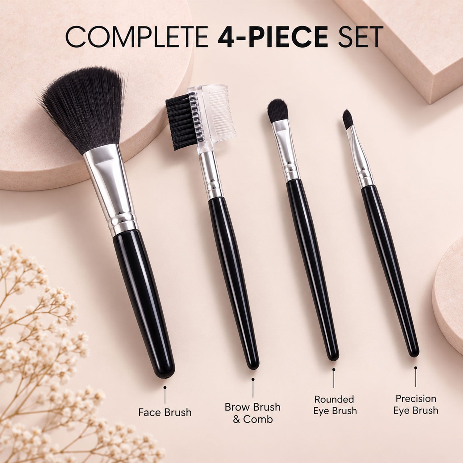 A complete 4-piece set of black makeup brushes with silver ferrules and black bristles, each labeled with its specific