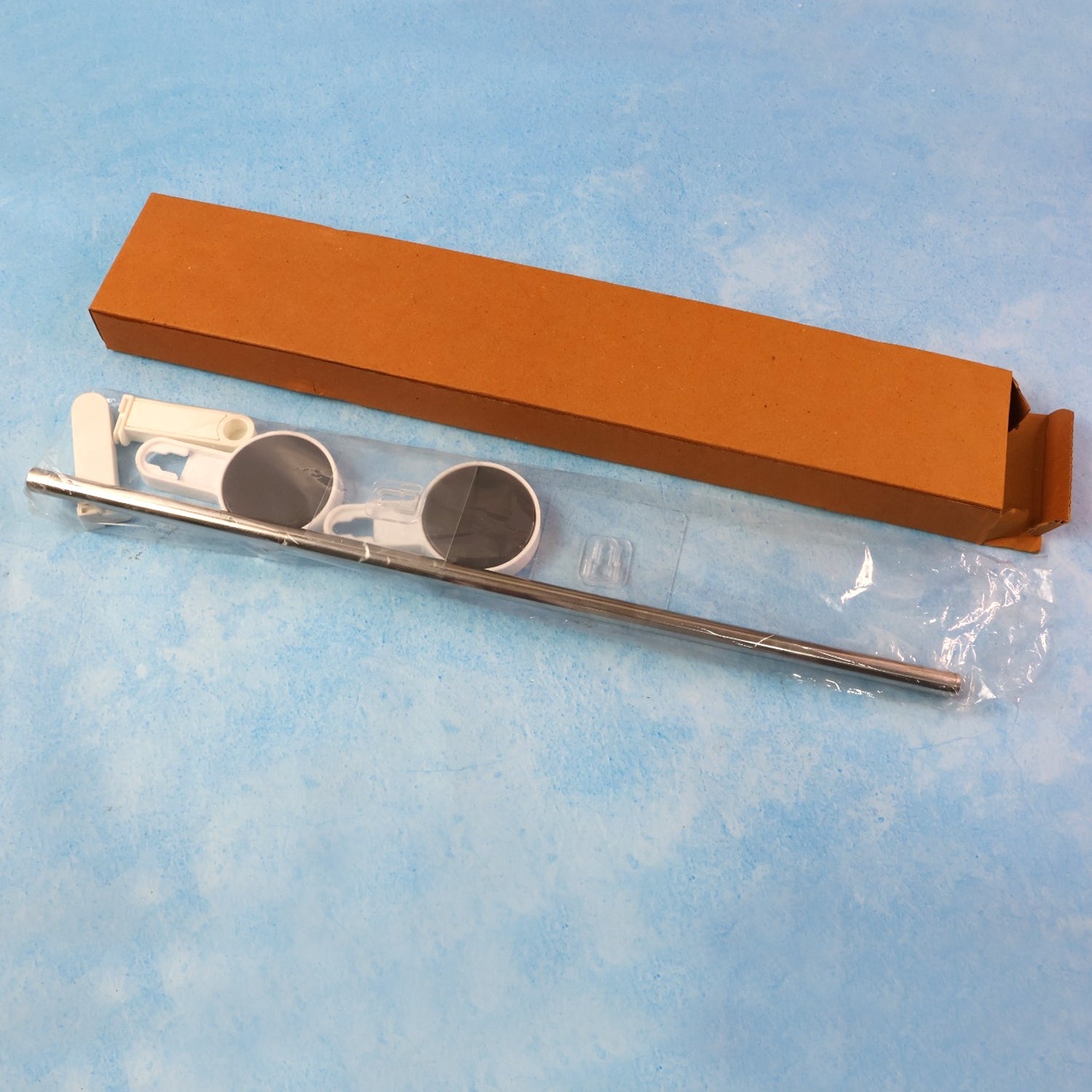 Self-adhesive towel rod installed in kitchen or bathroom setting
