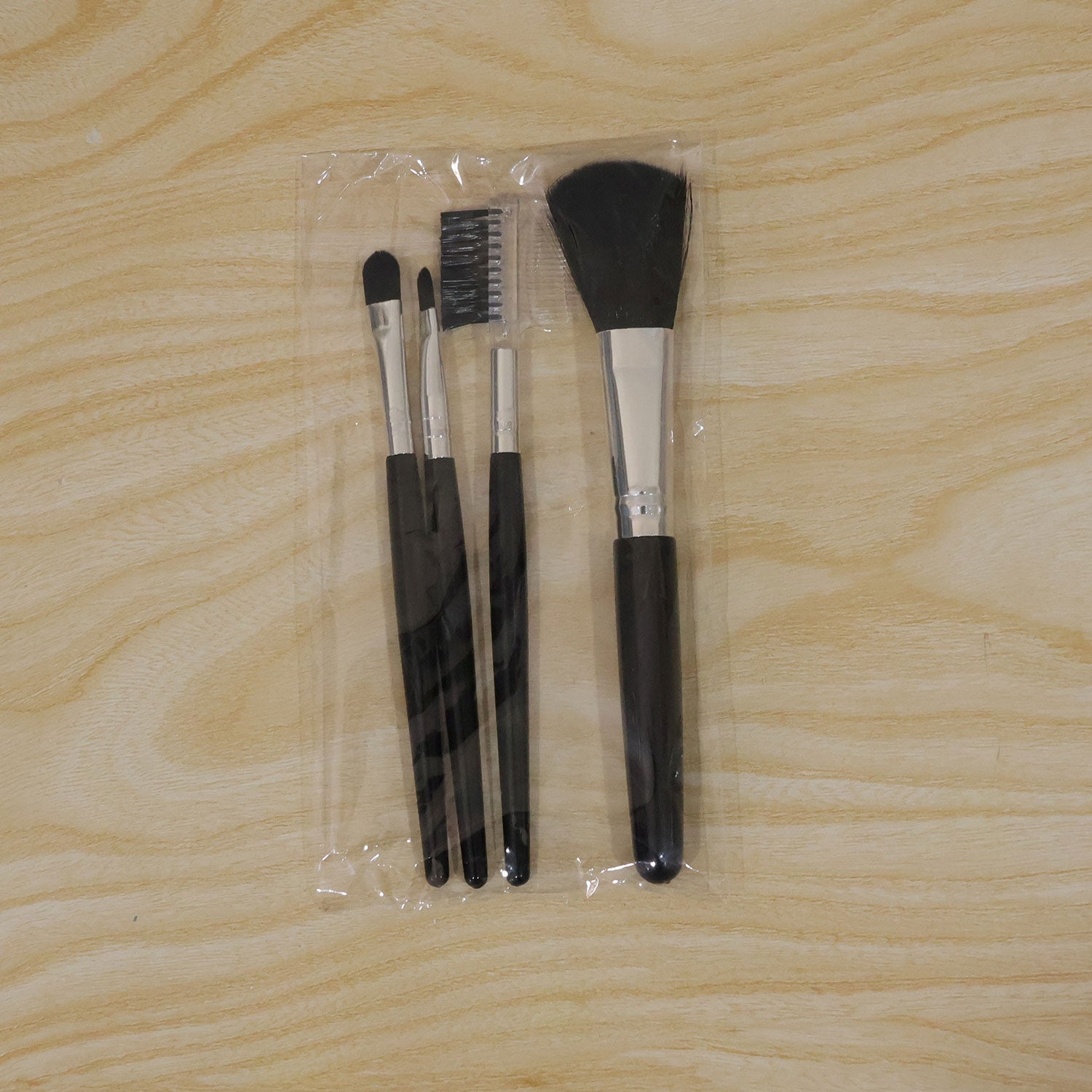 Compact 4-piece makeup brush set with various tools