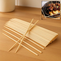 Natural bamboo skewers neatly arranged on a wooden surface