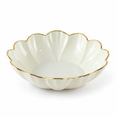 Empty white ceramic scalloped bowl with a gold rim on a plain white background.