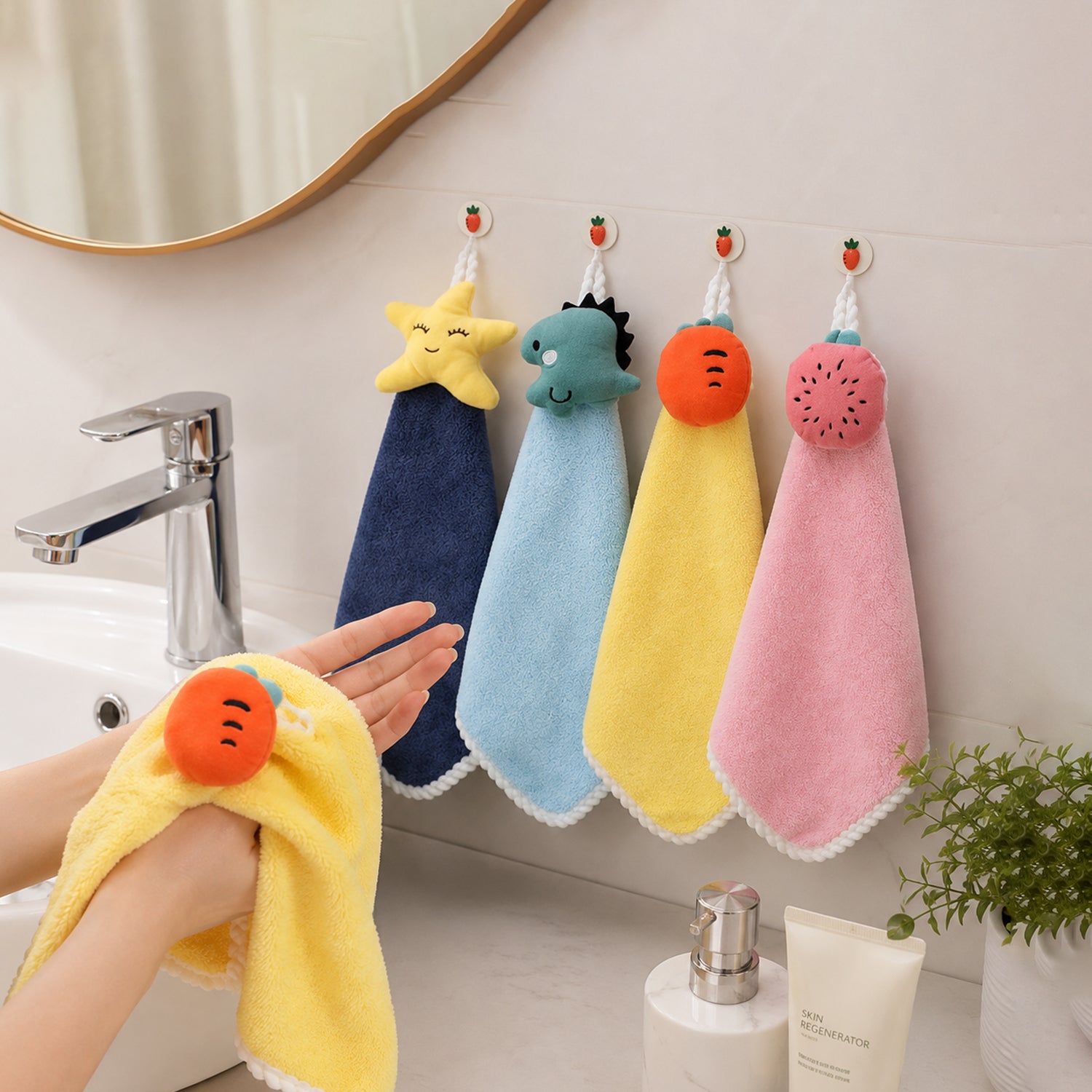 A person drying hands with a yellow carrot-shaped towel, with three other colorful animal-shaped towels hanging on â€“ view 8